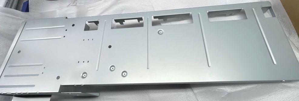 Actual press formed metal part from the JT Tube company-profile materials